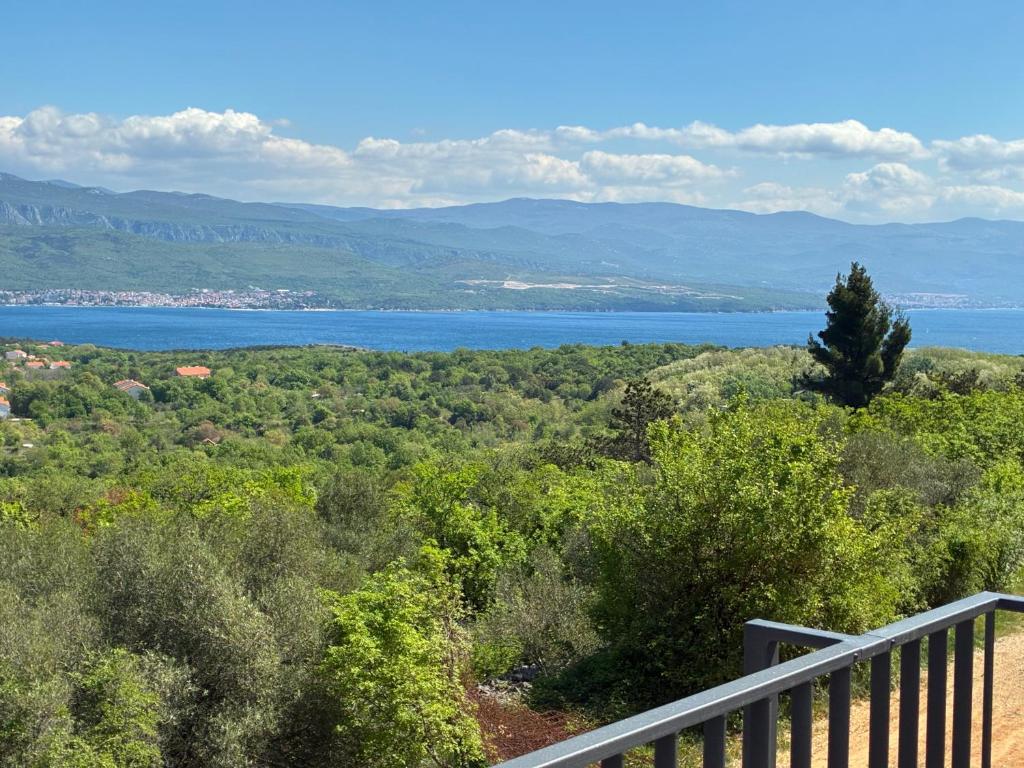 a view of a body of water from a balcony at Seaview apartments Refugium Krk in Polje