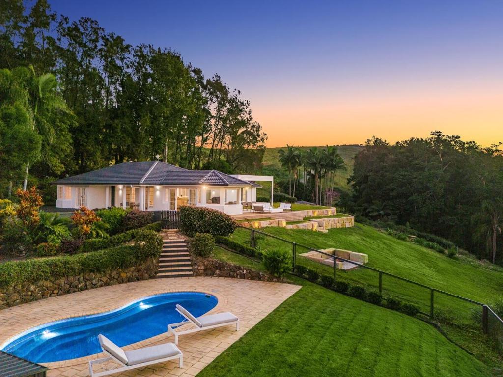 a house with a swimming pool in the yard at The Bower - Byron Hinterland in Teven