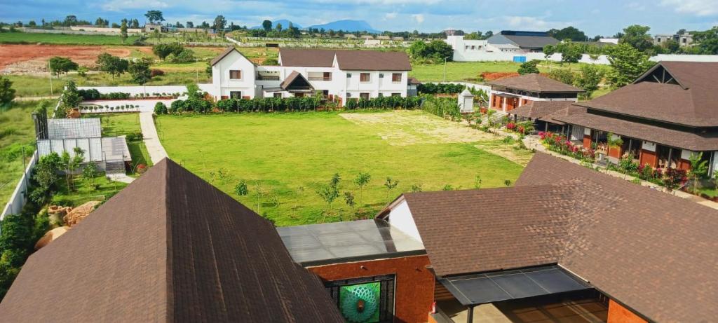 an aerial view of a house with a yard at Tridalam Resort in Bangalore