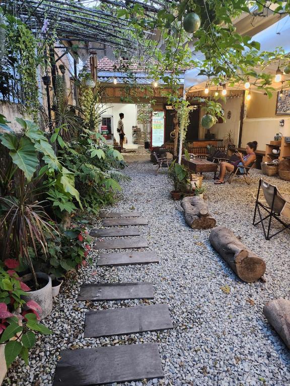 a garden with rocks and plants in a building at Outdo'r Garden House in Tuy Hoa