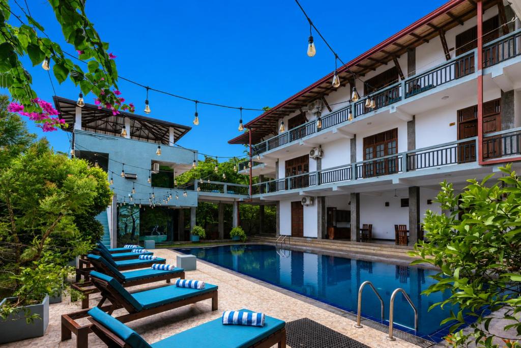 an image of a hotel with a swimming pool at Nova By Horizon Collection in Unawatuna