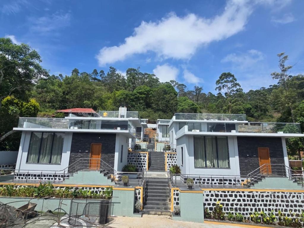 a house with stairs leading up to it at Silver Valley Villas in Yercaud