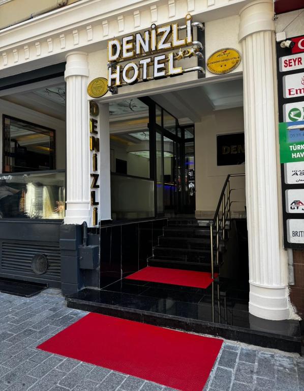 a hotel with a red carpet in front of it at Denizli Hotel in Istanbul