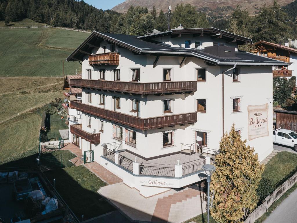 an aerial view of a large white building with balconies at Haus Bellevue in Serfaus