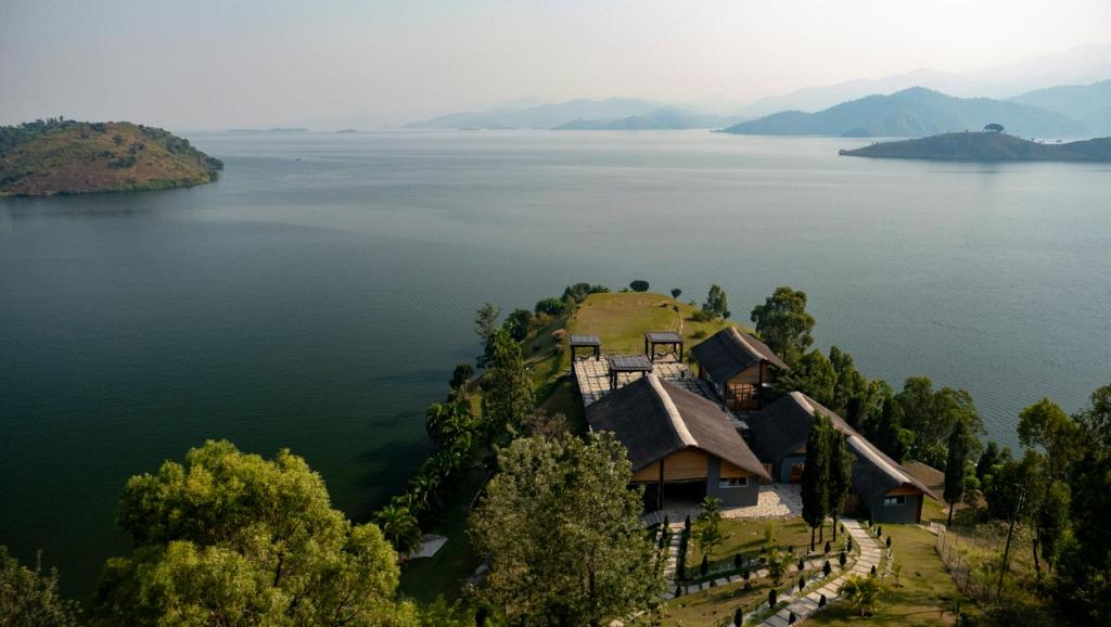 an island in the middle of a large body of water at LUX* Lake Kivu 