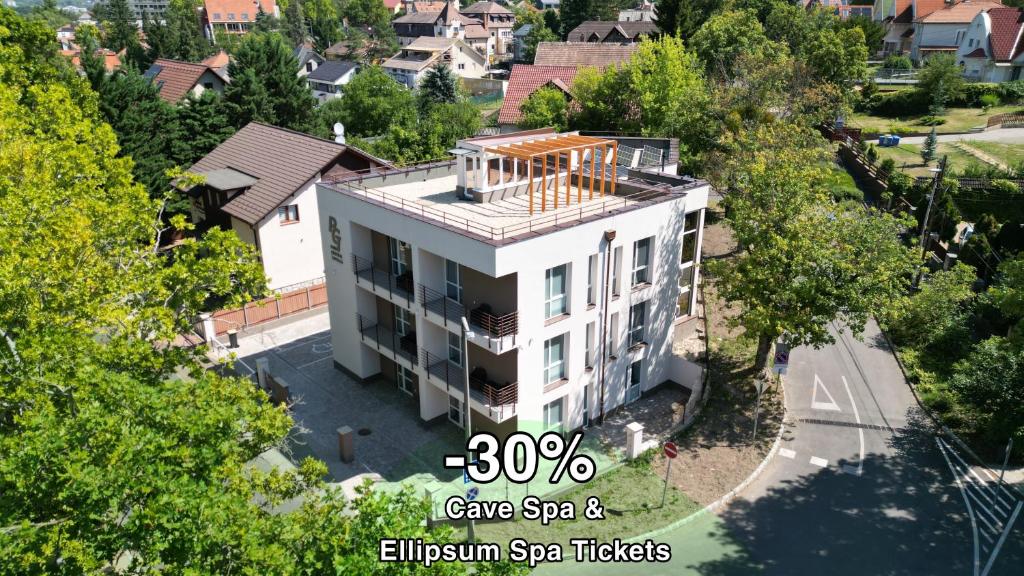 an overhead view of a large white house at Park Central Tapolca - Corner in Miskolctapolca