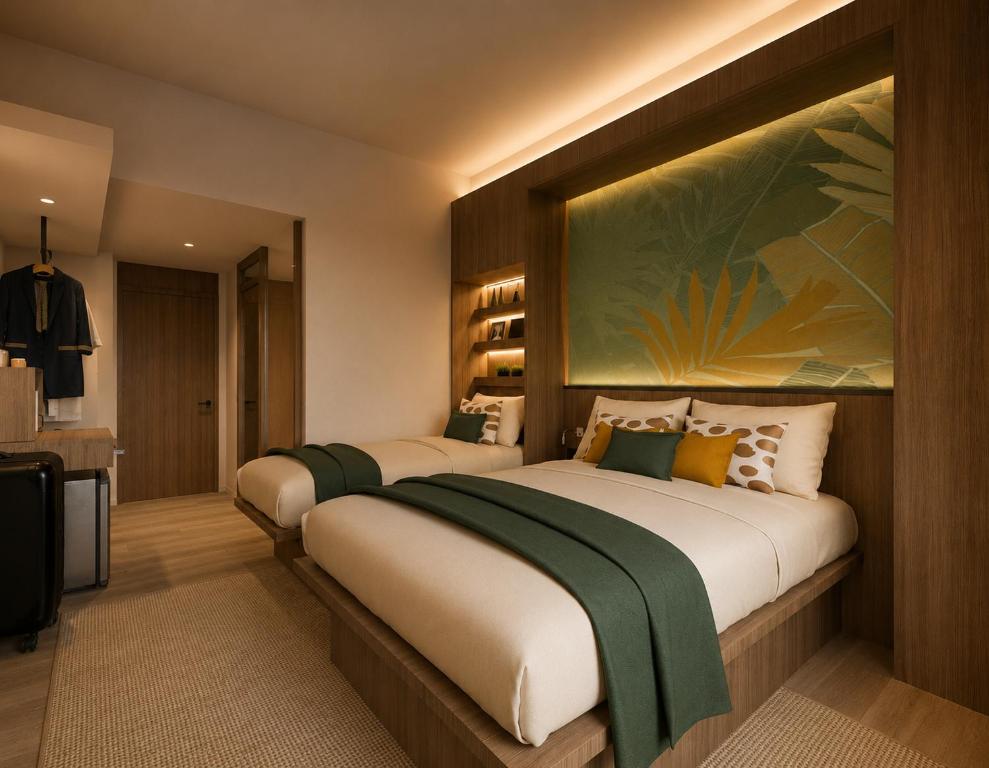 two beds in a hotel room with a large painting on the wall at Lokai Boutique Hotel in Dumaguete
