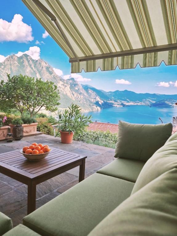 a living room with a couch and a table at IseoLakeRental - Collina Divina in Solto Collina