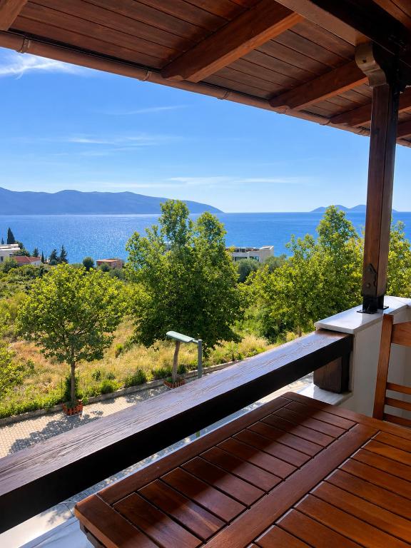 a view of the ocean from the porch of a house at Villa Hodo in Vlorë