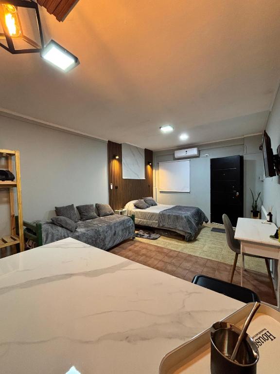 a living room with two beds and a couch at Urban Berazategui in Berazategui