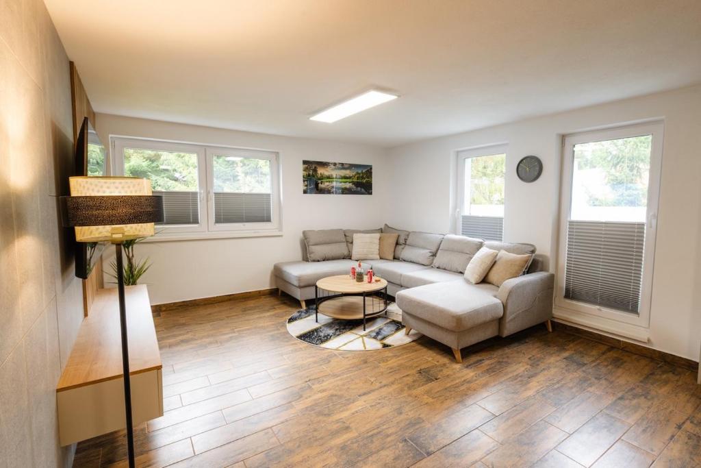 a living room with a couch and a table at Apartmány Slanica in Námestovo