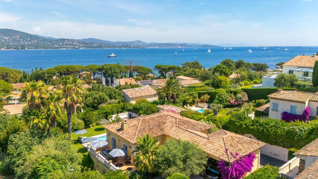 an aerial view of a town with houses and the ocean at Villa Seize St Tropez in Saint-Tropez