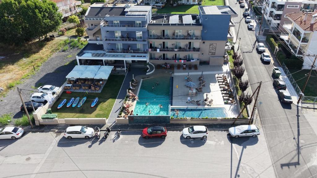 an aerial view of a building with a swimming pool at AEGEAN BLUE Apartments & Suites in Leptokarya