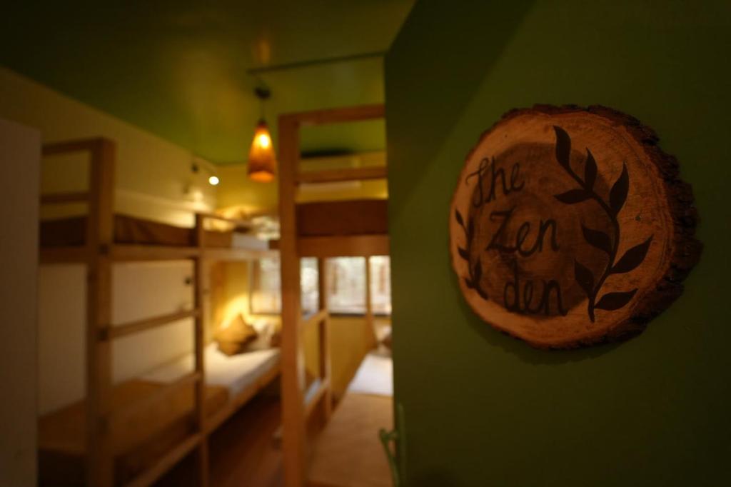 a bedroom with a sign that says the new year on the wall at Zen Colive in Pune