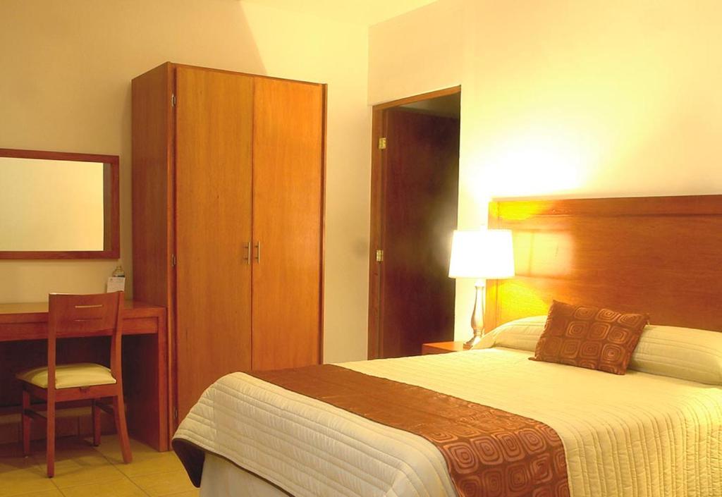 Postel nebo postele na pokoji v ubytování Hotel Marllou