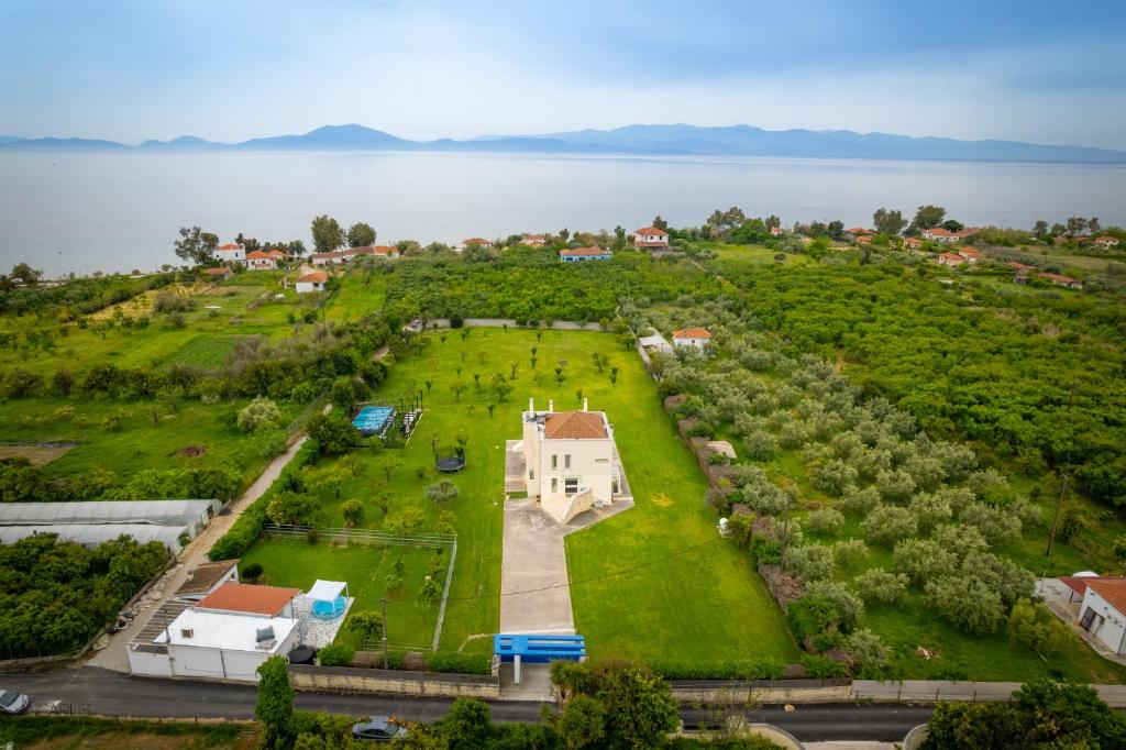 an aerial view of a large park next to a lake at Green Galini Villa Pelion in Káto Lekhónia
