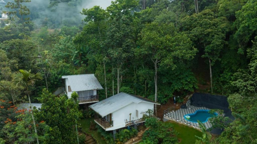 an aerial view of a house in the forest at Wild Stories Resort, Munnar in Anachal