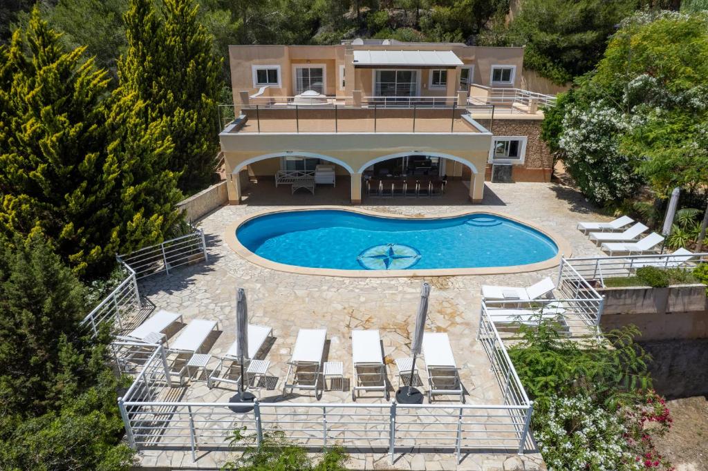 an aerial view of a house with a swimming pool at Ses Casetes Abajo in San Jose