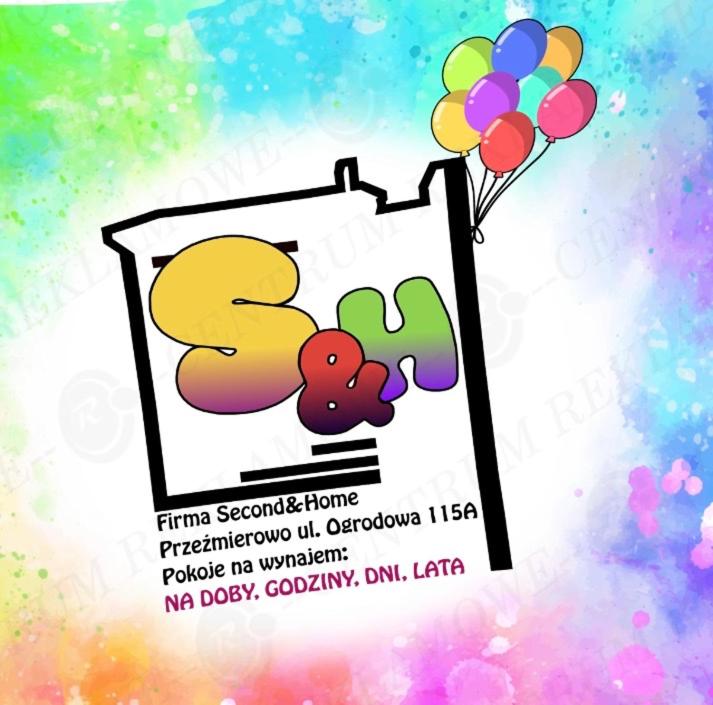 a picture of a sign with a bunch of balloons at Second&Home in Przeźmierowo