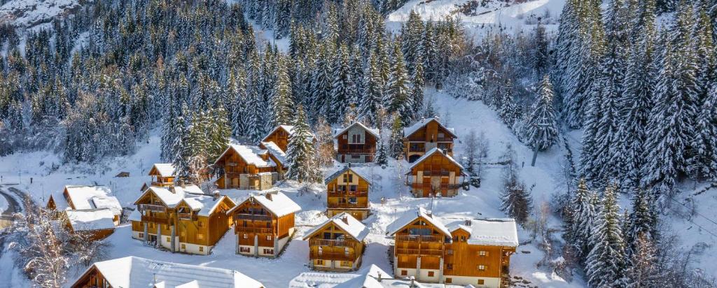 an aerial view of a lodge in the snow at LesChalets de Pré Genty in Oz