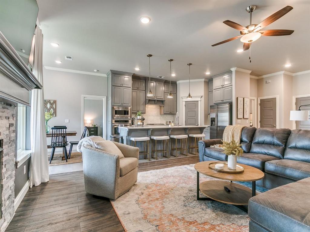 a living room with a couch and a table at Exquisite Escape in Moore! in Moore