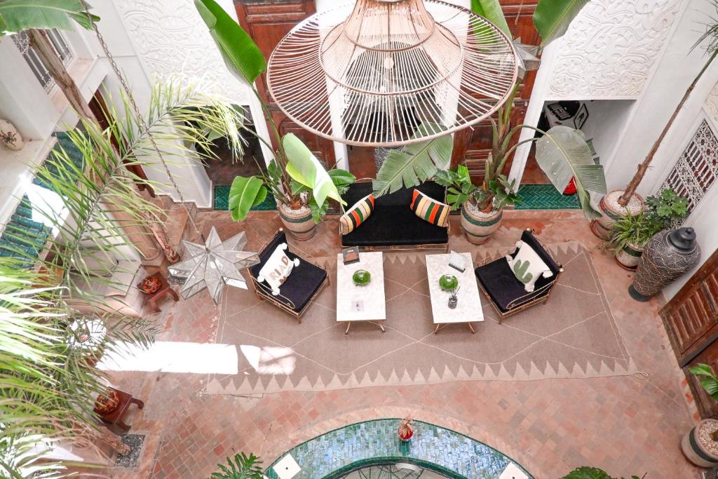 an overhead view of a table with chairs and plants at Riad N'S & Spa in Marrakesh