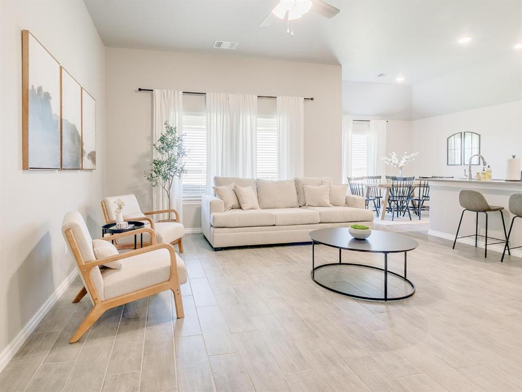 a living room with a couch and a table at Oklahoma City's Hidden Gem in Moore