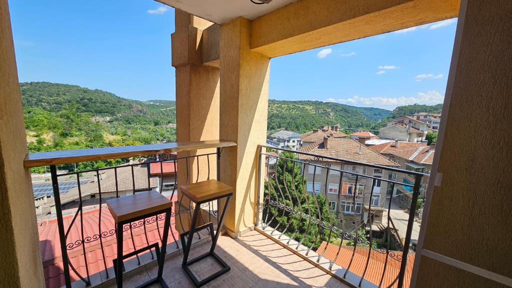 a balcony with a view of a city at Perspective View in Veliko Tŭrnovo