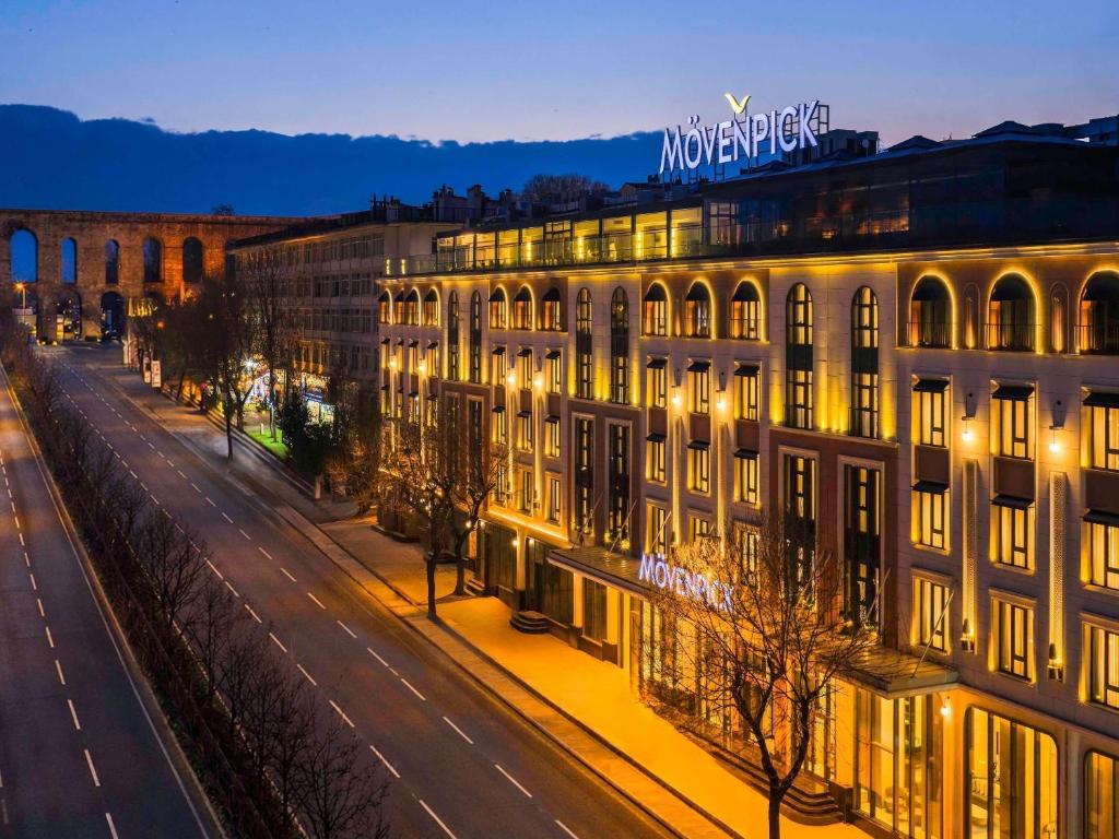 a building on a street at night with lights at Mövenpick Istanbul Old Town in Istanbul