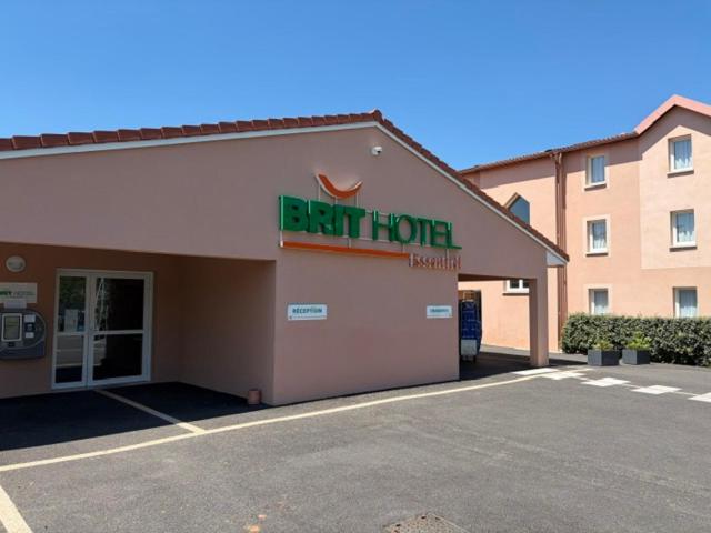 a fast house with a sign on the side of it at Brit Hotel Essentiel Millau in Millau