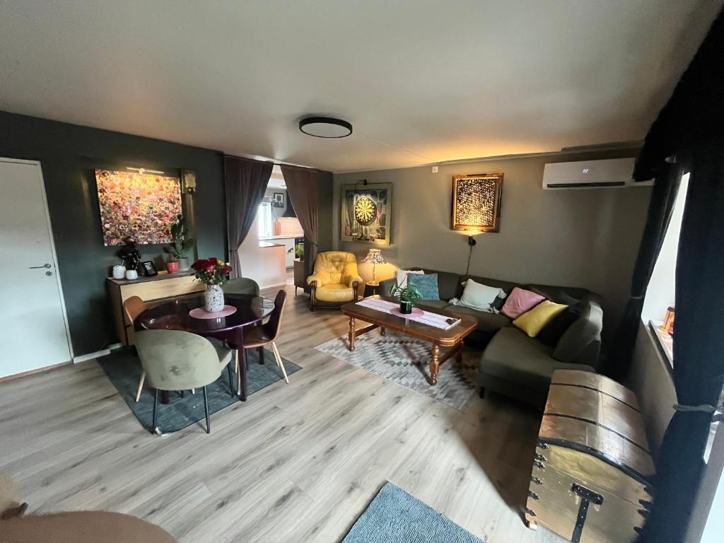 a living room with a couch and a table at Trolladalen-Sogndal in Sogndal