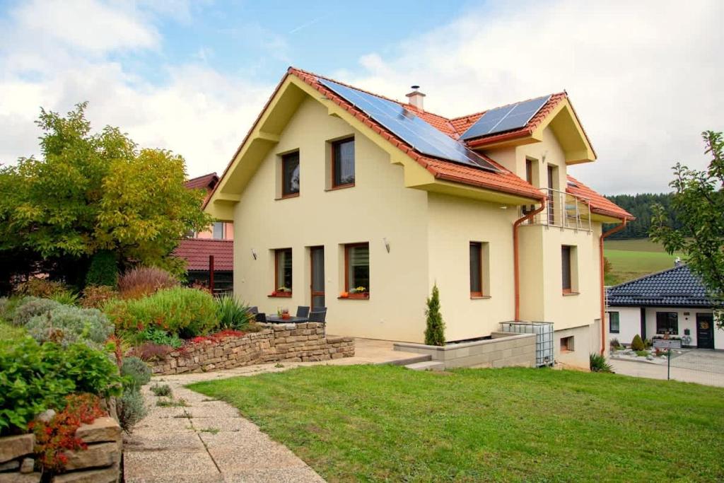 a house with a roof with solar panels on it at Villa Gallera - Slovak Paradise in Dravce