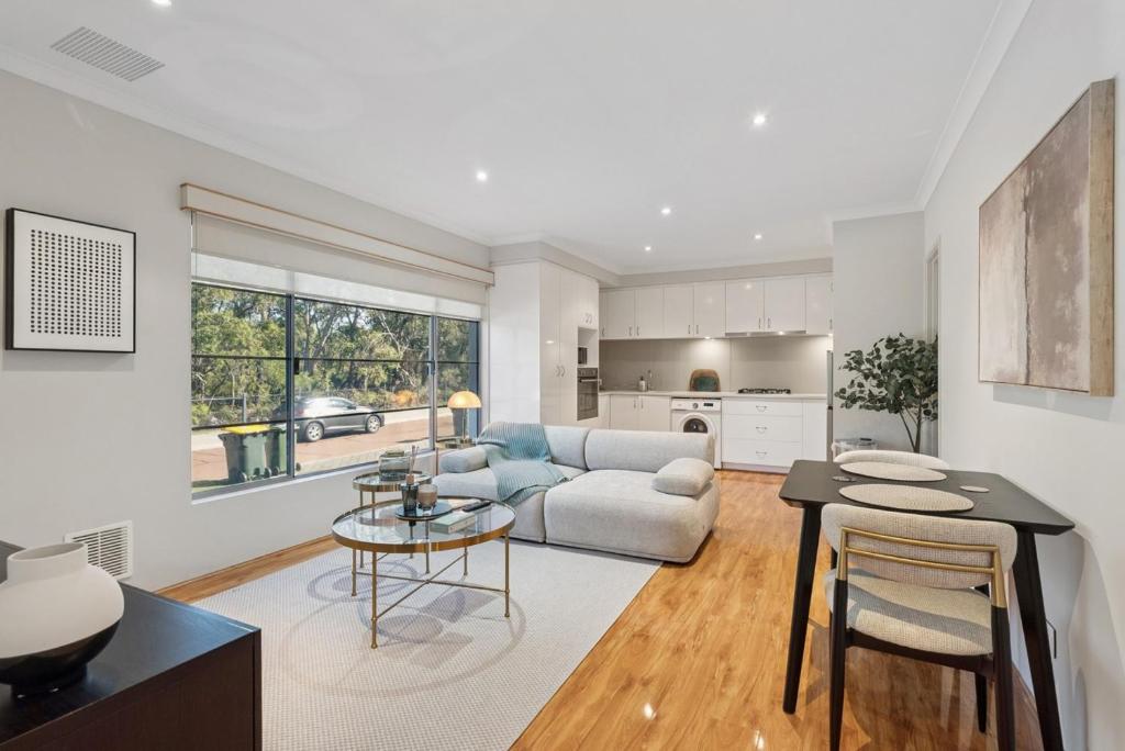 a living room with a couch and a table at The Aveley Retreat in The Vines