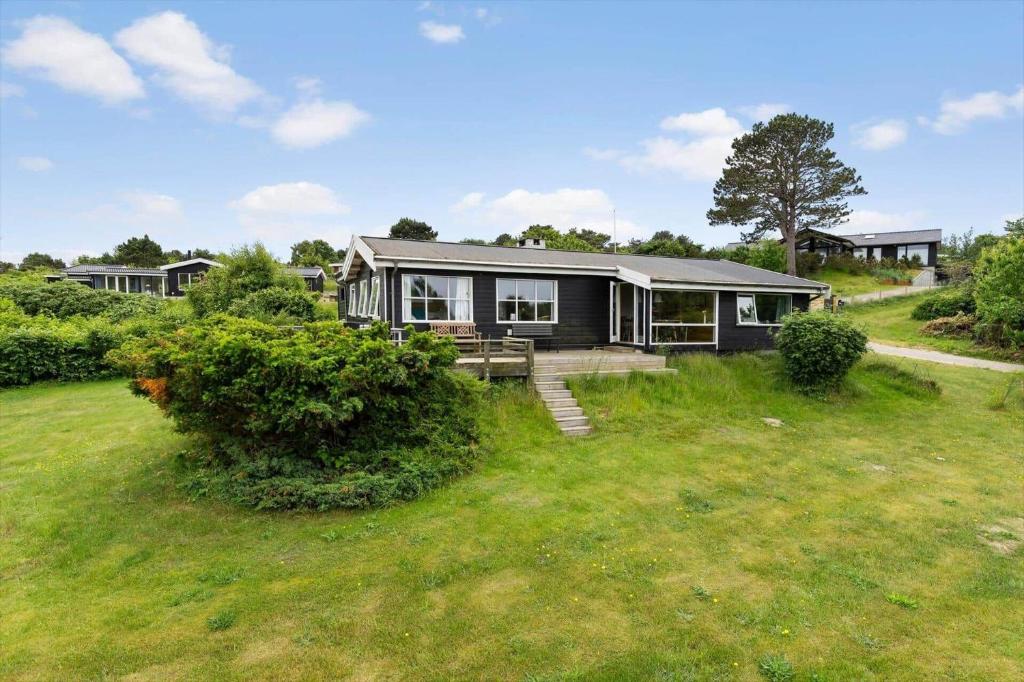 a home with a large yard with a house at 1693-Kikhavn-Kragevejen-3 in Kikhavn