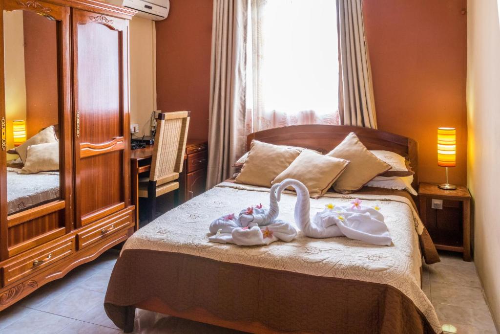 Postel nebo postele na pokoji v ubytování Sunset Villa