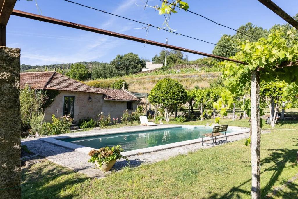 a pool in the backyard of a house at Casa do Capitán in Leiro