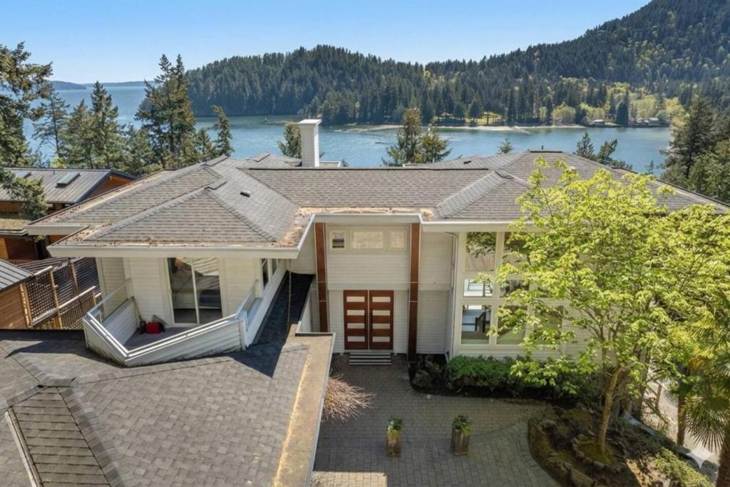 a house with a view of a lake at Bowen Island Ocean Retreat in Bowen Island