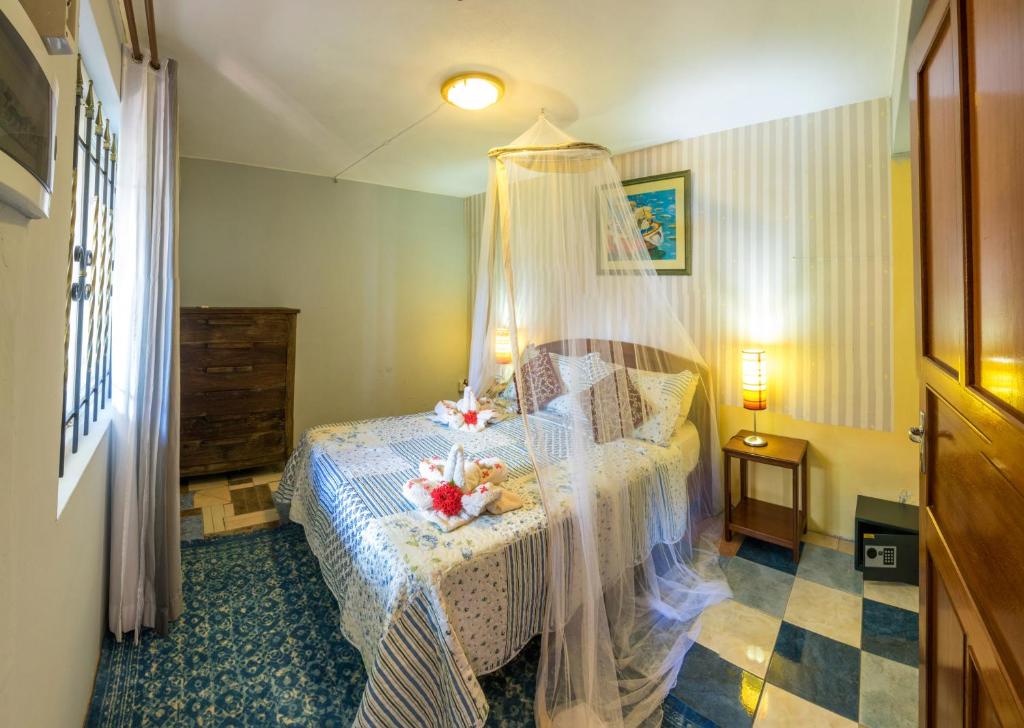 Postel nebo postele na pokoji v ubytování Sunset Villa