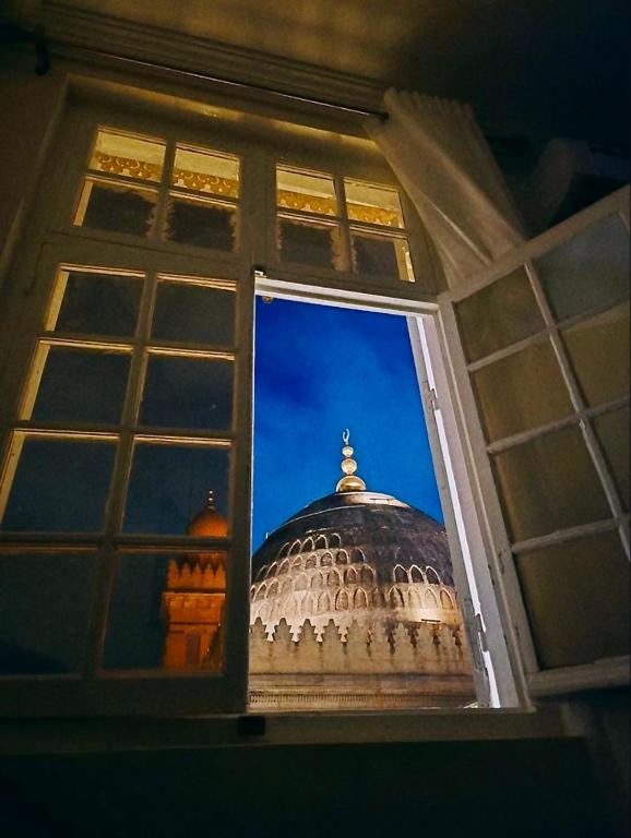 a view of a domed building through a window at Marhaba Hotel Casbah in Kasbah