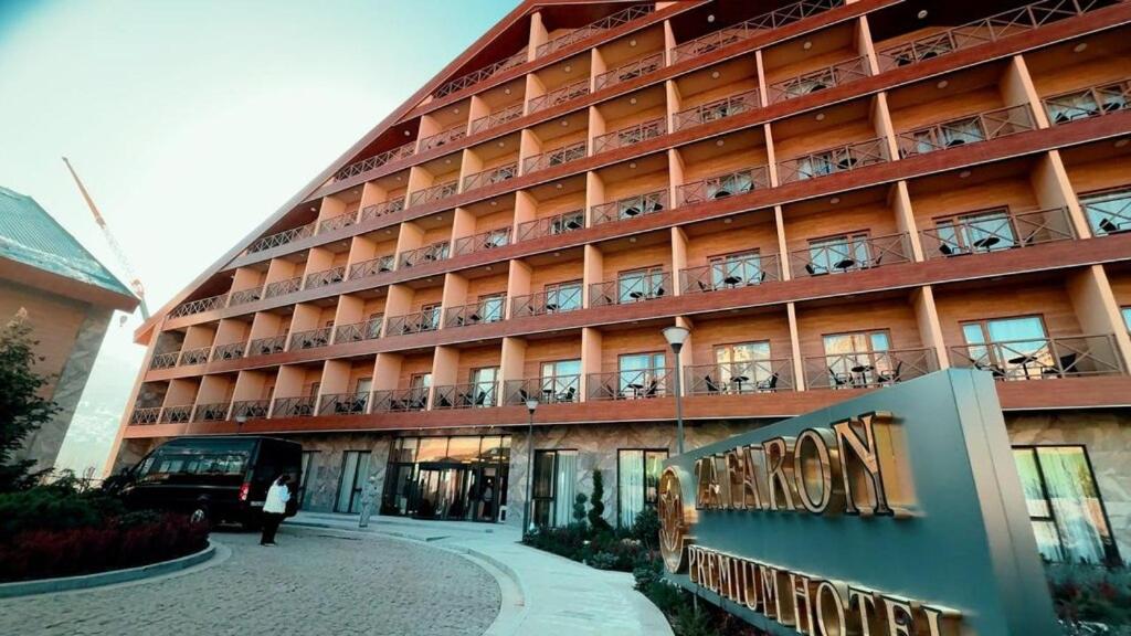 a large building with balconies on the side of it at Zafaron Premium Hotel in Chimgan
