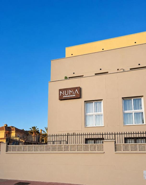 a building with a nintendo sign on it at NUMA Beach Apartments in Aguadulce