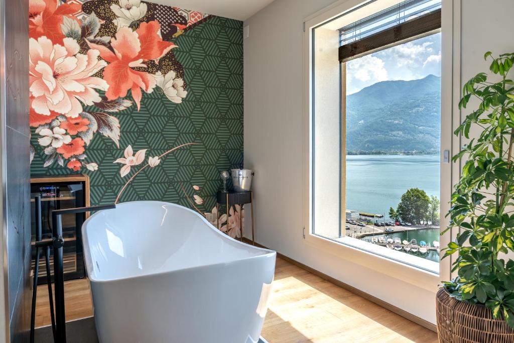 a living room with a wall mural of flowers at B&B Antenhofer Lovere in Lovere