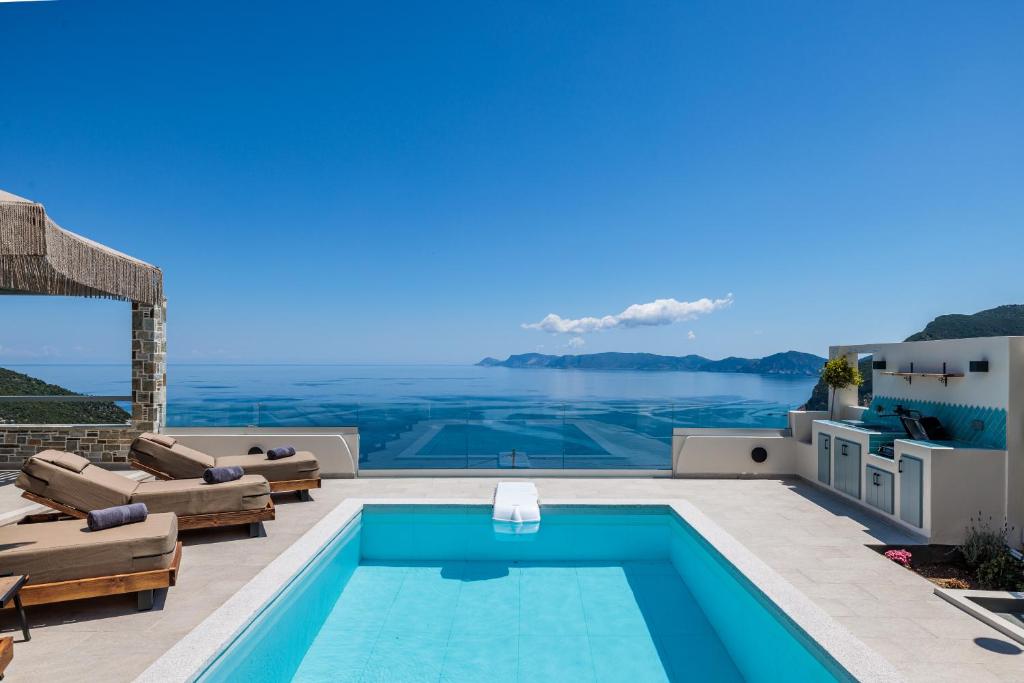 a villa with a swimming pool with a view at Villa Aerys in Skopelos Town