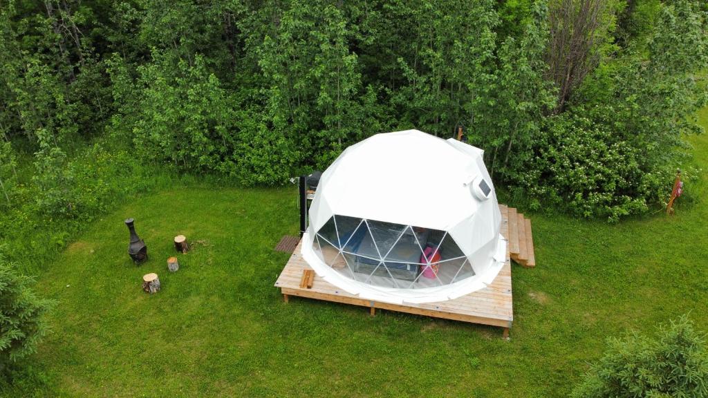 an aerial view of a white tent on a deck at Dôme Romanov in Saint-René-de-Matane