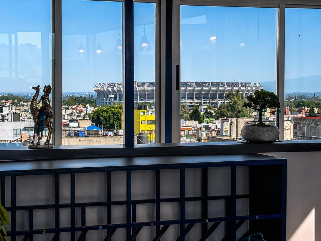 a view of a stadium from a window at Habitación individual con baño privado a 3 Min del Estadio Azteca-Banorte y muy cerca de zona de hospitales in Mexico City