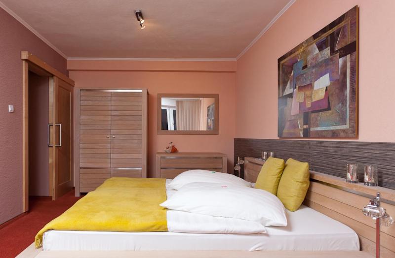 Postel nebo postele na pokoji v ubytování Hotel Relax