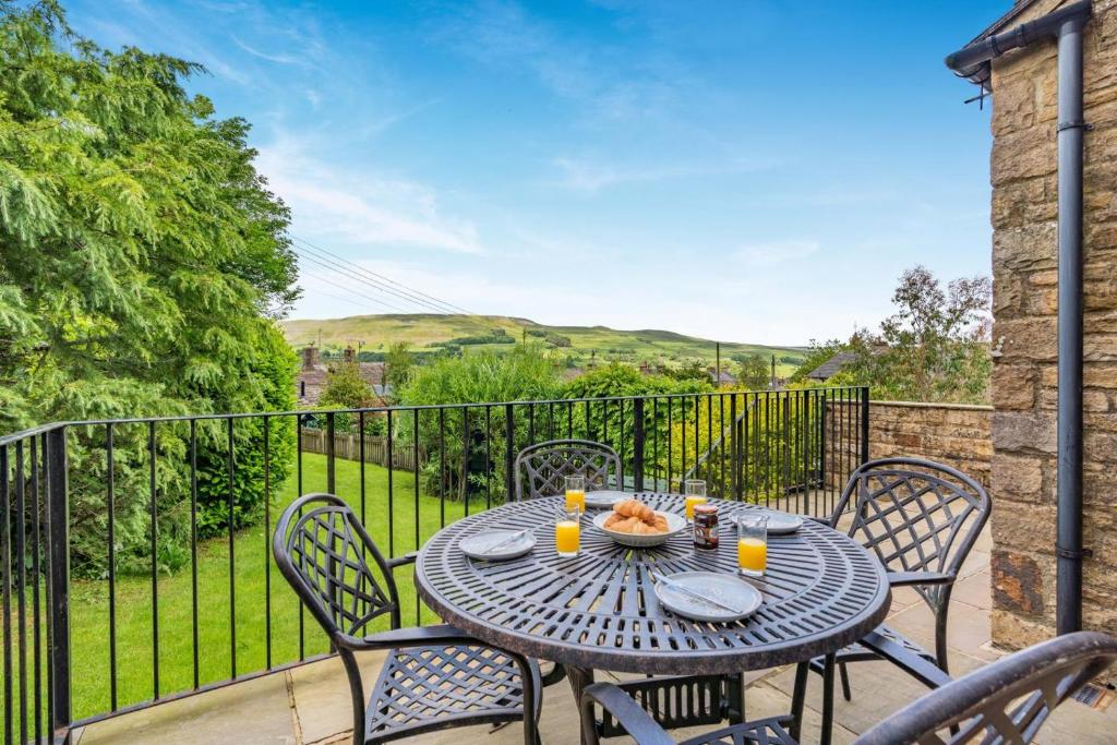 a table and chairs on the balcony of a house at 3 Bed in Hawes oc-ds967 in Hawes