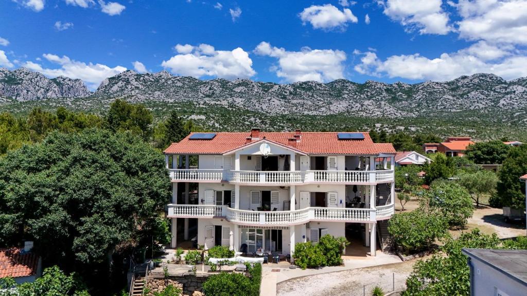 an aerial view of a house with mountains in the background at Vila Velebita in Seline