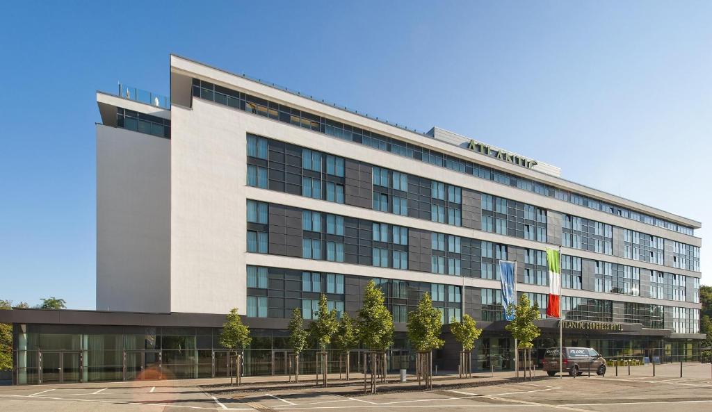 a large white building with a lot of windows at Atlantic Congress Hotel Essen, WorldHotels Elite in Essen