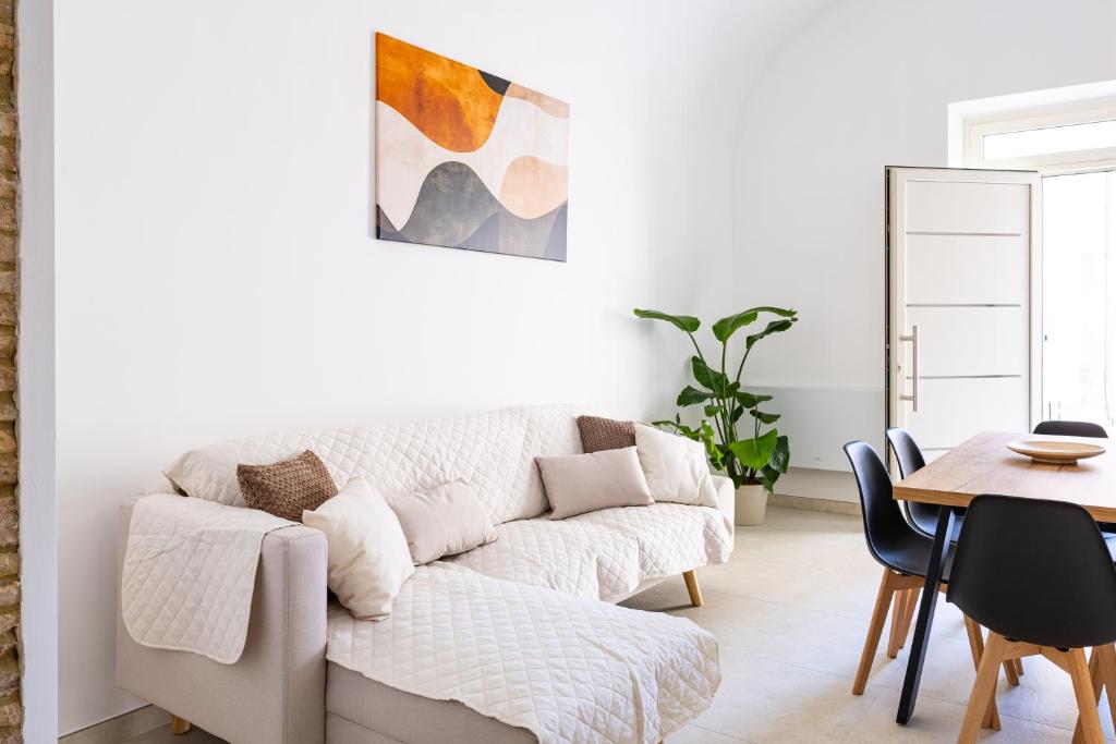 a living room with a couch and a table at La casina - YourPlace Abruzzo in Fossacesia